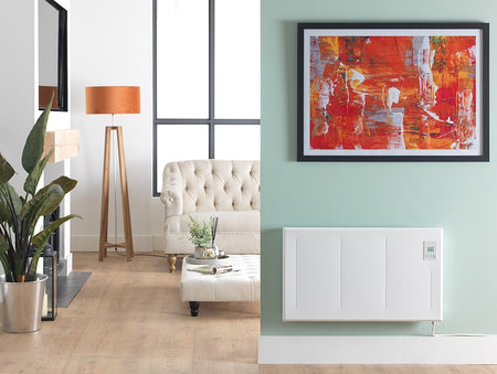 Living room with a white radiator on a light green wall, abstract art, and decor elements.