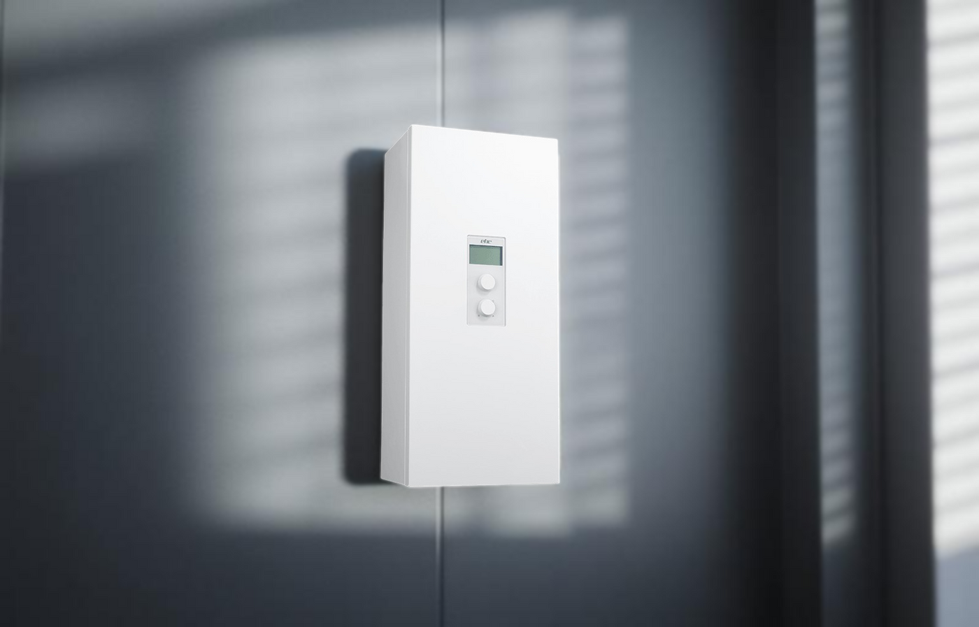 Compact electric boiler heater mounted on a wall, showcasing its sleek design and control panel.