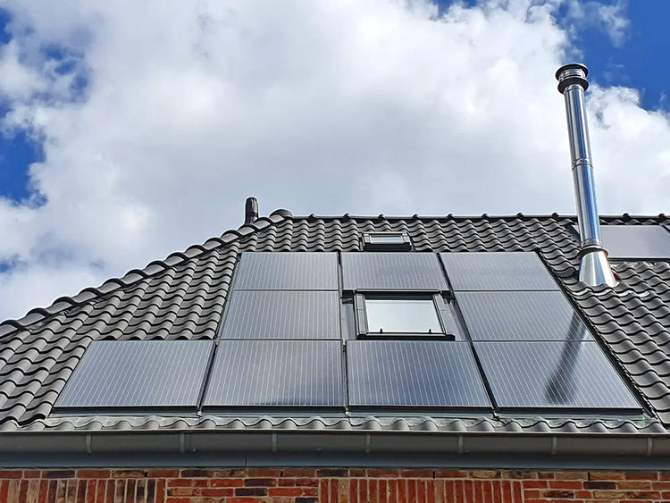 Solar Panels installed on a modern roof under a clear blue sky, showcasing a sleek and efficient energy solution.