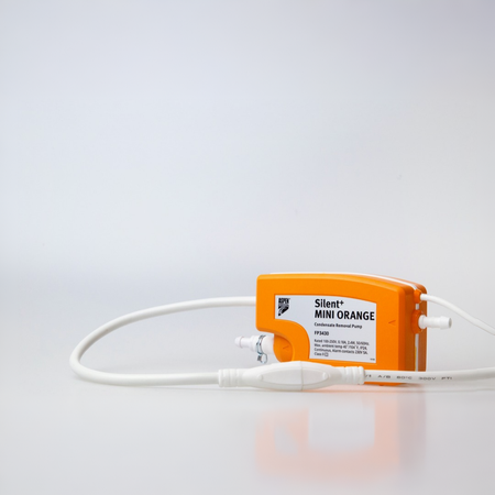 An orange and white Aspen Pumps Silent+ Mini Orange air conditioning condensate pump with attached white tubing, photographed on a clean white studio background.