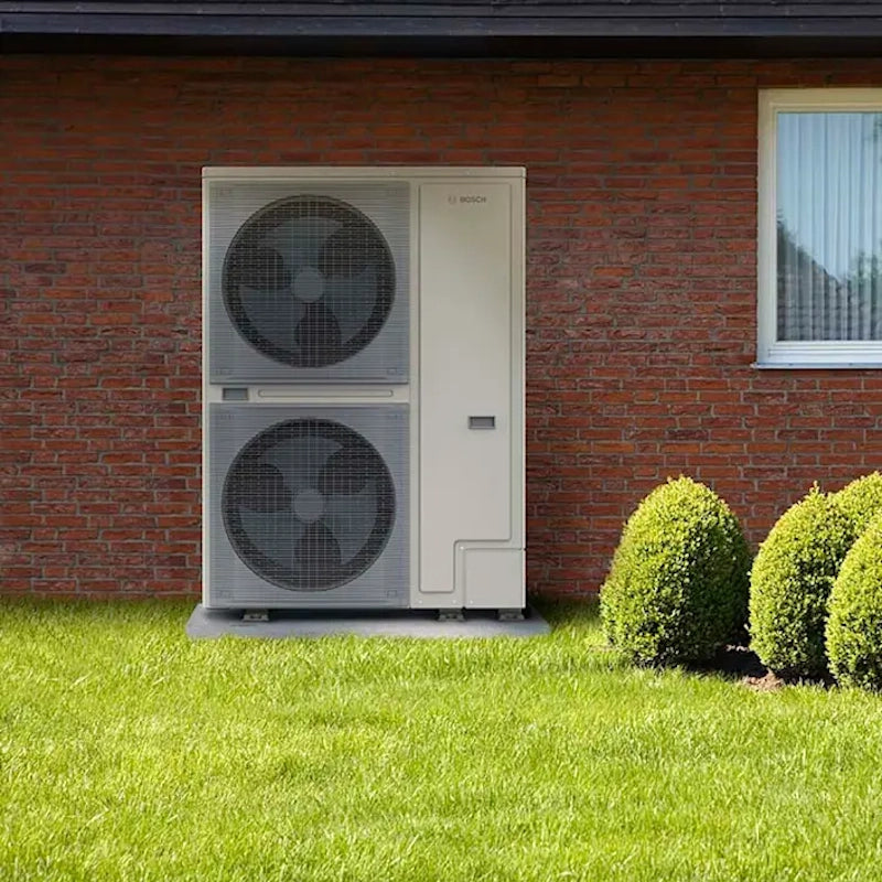 Worcester Bosch Compress 2000 AWF heat pump installed outside a home, designed for efficient heating and hot water.