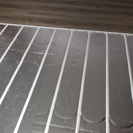 ThermRite PRO 16mm dual purpose foiled EPS 400 insulation panel installed with pipe centres for underfloor heating.