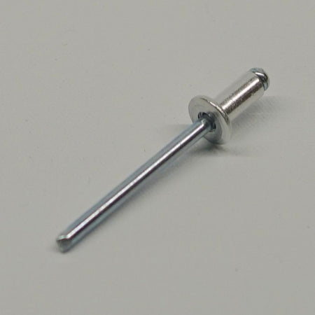 Metal rivet on a gray background
