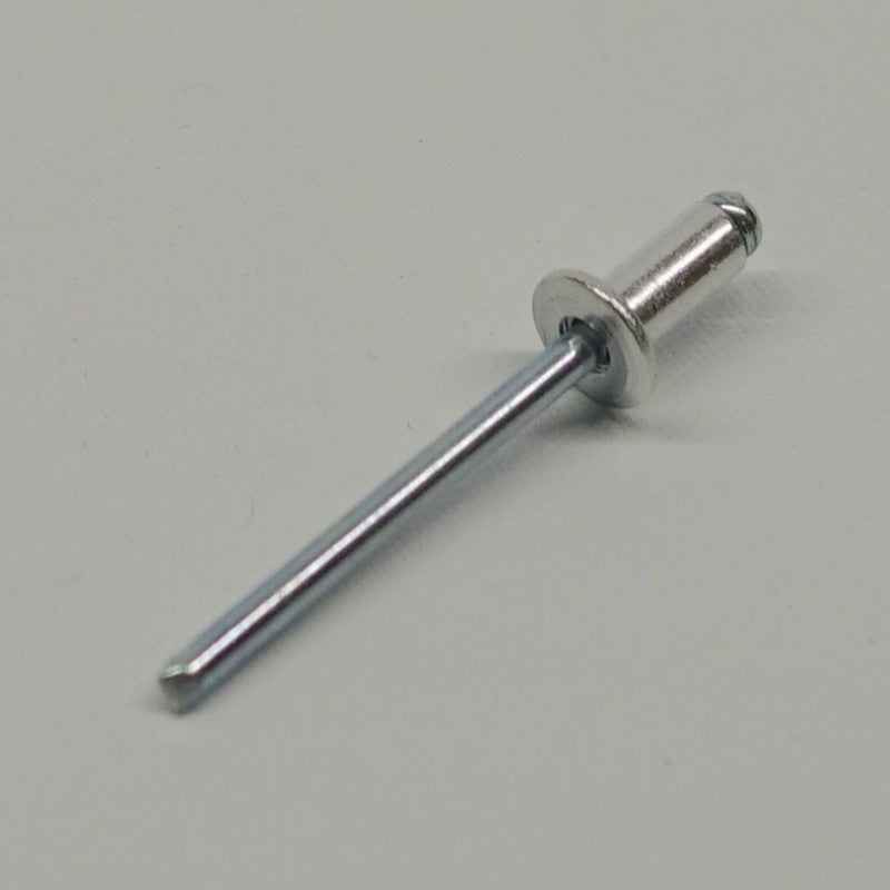 Metal rivet on a gray background
