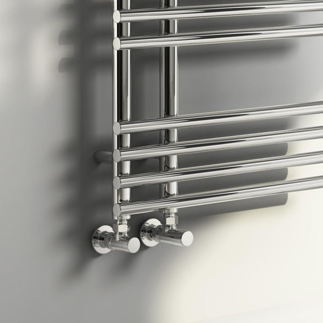 Chrome towel radiator on a gray wall